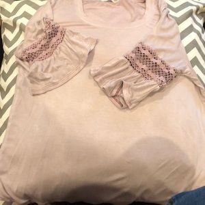 A pink top with lace on the sleeves!